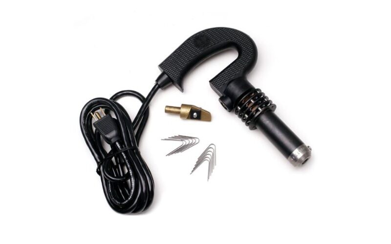 A black electric cord with an electrical plug and some wires